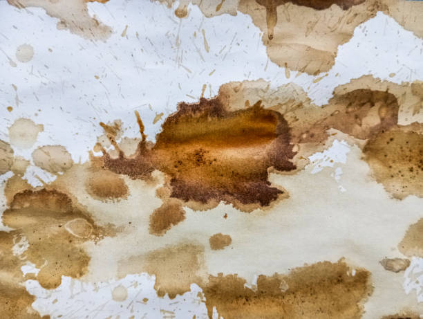 istock Abstract coffee grunge background. Brown coffee stains on white paper with copy space. Dirty paper with coffee drops. Coffee splash texture with copy space. Modern brown illustration. 1808318747