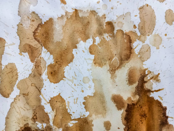 istock Abstract coffee grunge background. Brown coffee stains on white paper with copy space. Dirty paper with coffee drops. Coffee splash texture with copy space. Modern brown illustration. 1808319179