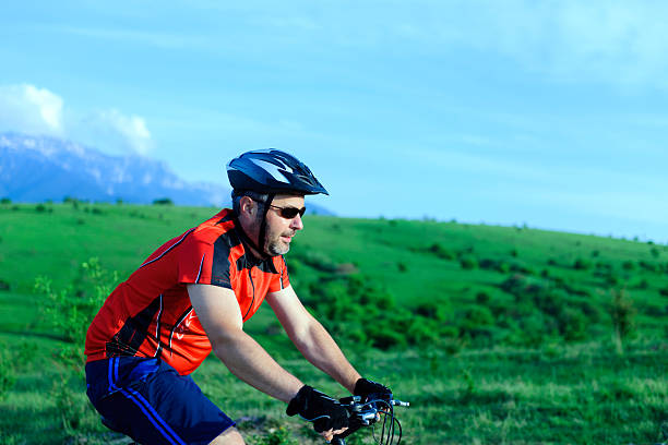 istock man riding bike 180832336