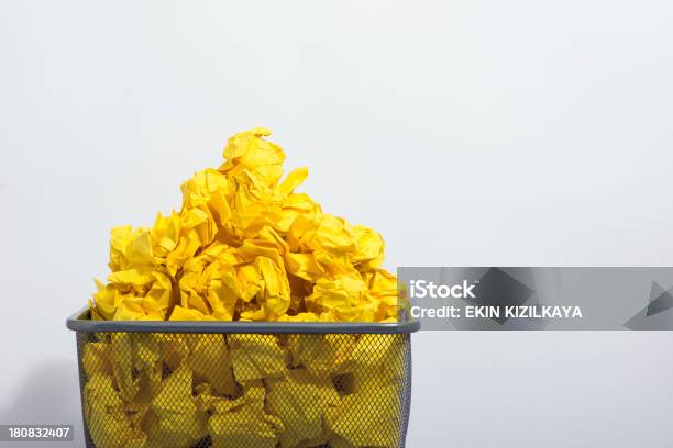 Trash Basket And Yellow Papers Stock Photo - Download Image Now - Heap, Crumpled Paper Ball, Yellow