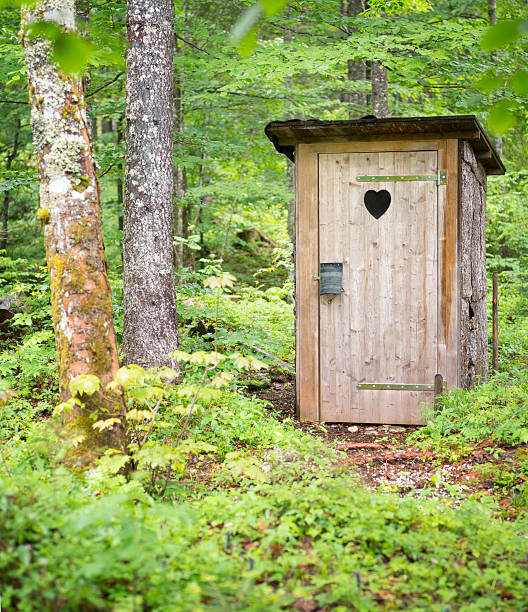 Outhouse A typical outhouse with heart carving located up high in the middle of an Austrian Nature Reserve. Outhouse stock pictures, royalty-free photos & images