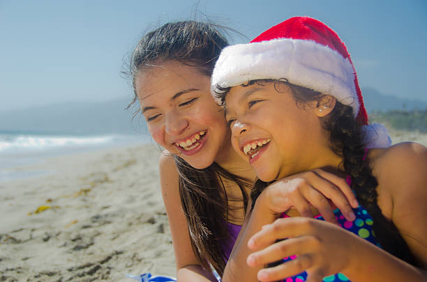 istock Happy Hispanic girls on the beach 180833692