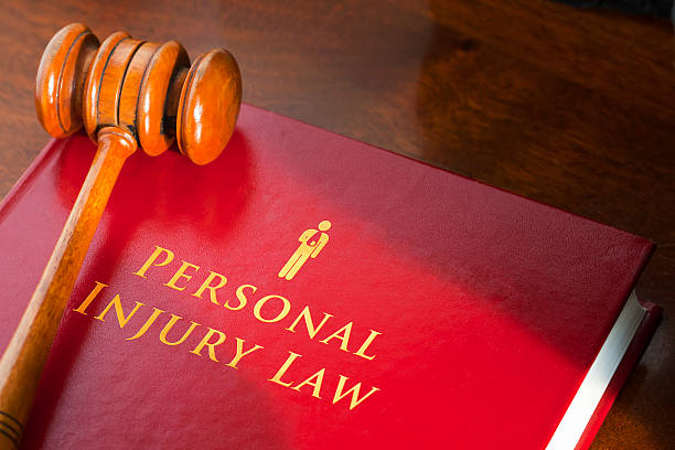 Book on personal injury law with a judge's gavel stock photo