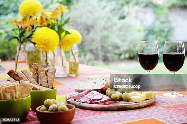 Party Table With Yellow Flowers Wine Buffet At Garden Stock Photo - Download Image Now