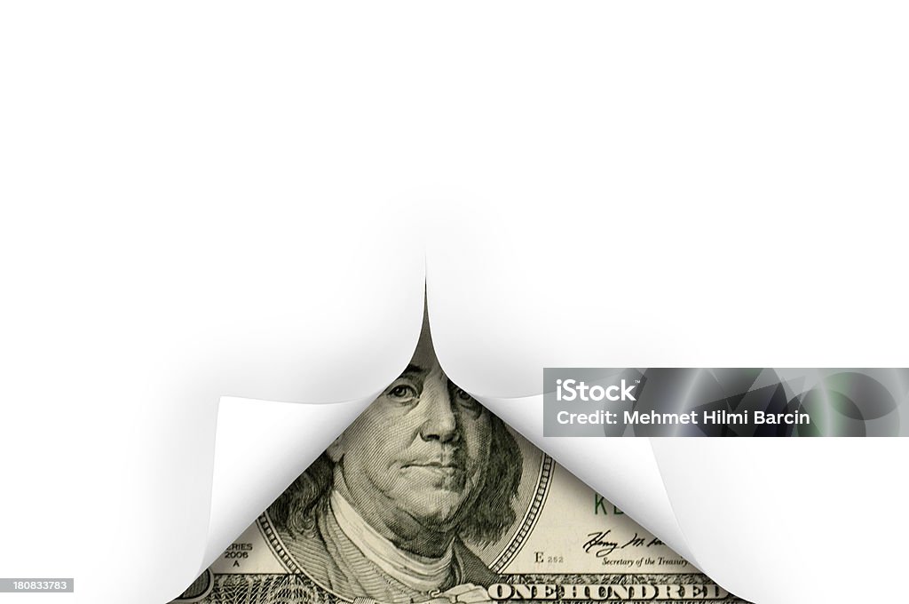 Dollar and page curl Close up white curled up paper with US currency of hundred dollar bill. Growth Stock Photo