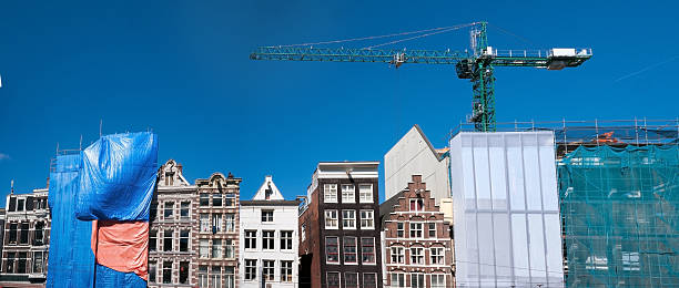 Amsterdam is a dynamic building site. Historic building are renovated and new building are build between the old ones, often in a very limited building space
