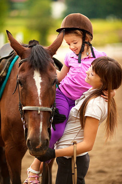 istock Child and horse outdoors. 180834026