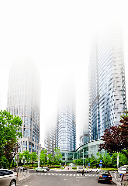 Fog city Building in the city of fog qingdao stock pictures, royalty-free photos & images