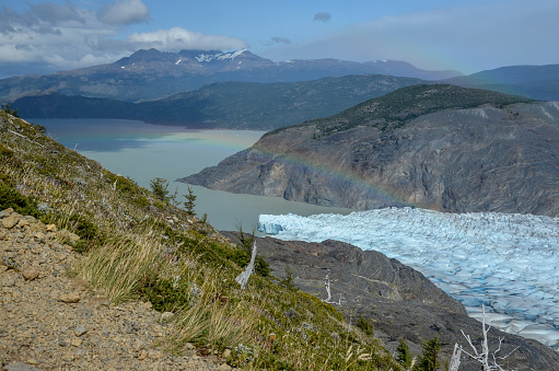 Rainbow over the famous Grey Glacier in Torres del Paine national park in Chile, Patagonia, South America