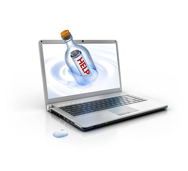metallic stylish laptop PC with help message in a bottle