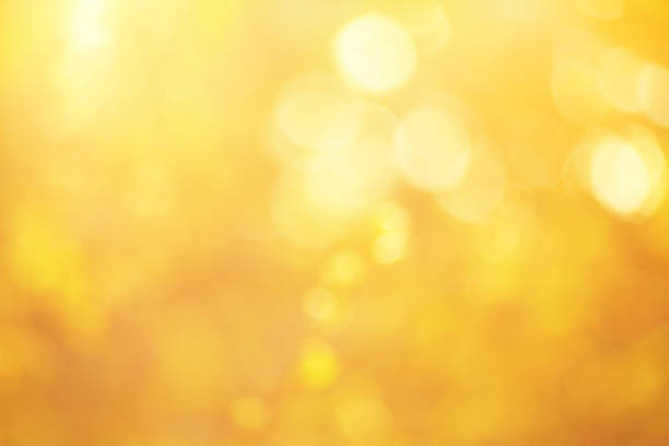 złoty bokeh - gold backgrounds textured textured effect stock illustrations