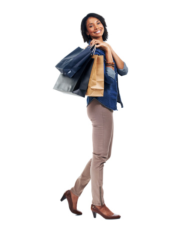Full-body of an african-american woman carrying shopping bags