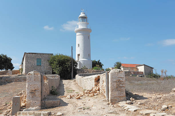 Paphos, Cyprus - December 22, 2023: View to a  historical lighthouse in Paphos Archeological Park.