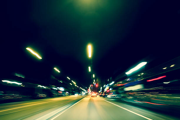 Highway driving at night with long exposure light trails