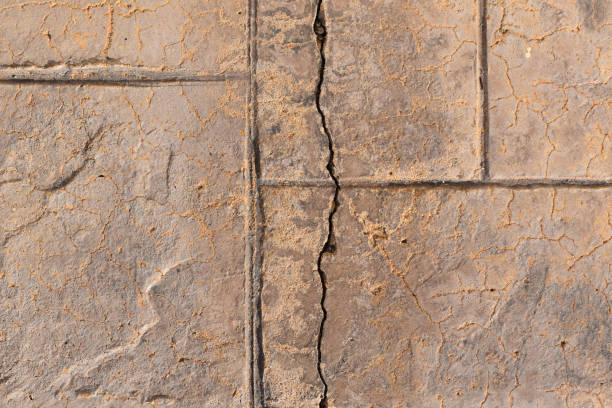 istock Old cracked stamped concrete floor texture background. 1808377006