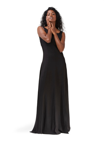 Full length studio shot of a beautiful indian woman in a long black dress