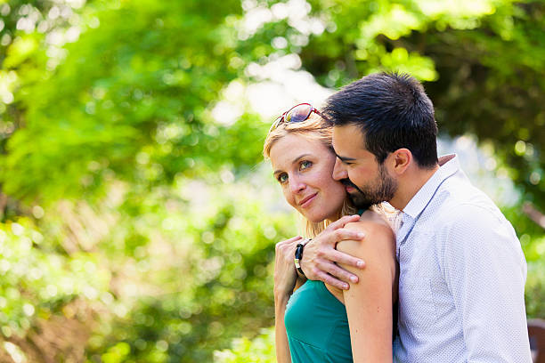 istock Romantic Couple Embracing in the Nature 180837971