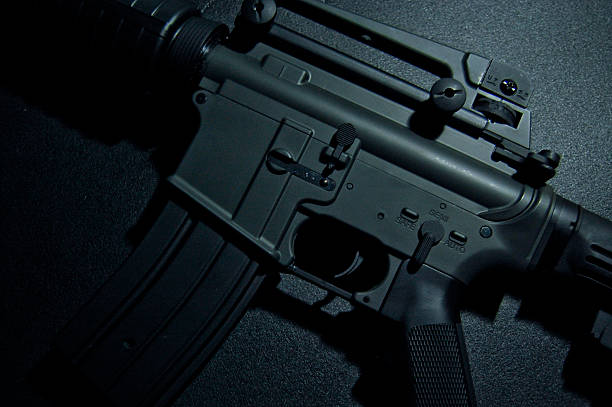 istock Gun close up over grunge background 180838009