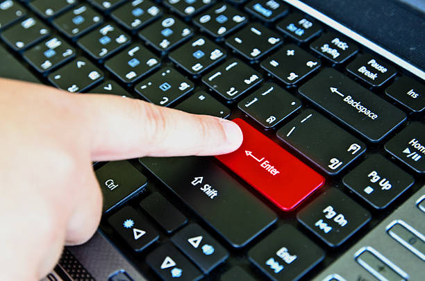 istock Finger of chind pushing the button Enter keyboard 180838196