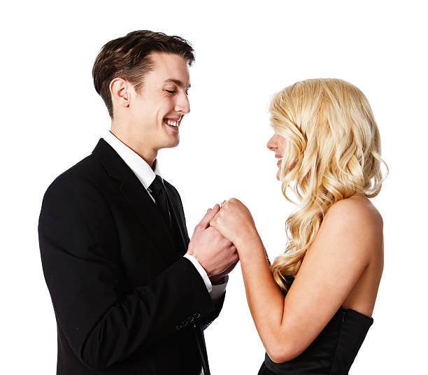 istock Handsome young couple hold hands: Prom night or engagement picture? 180838245