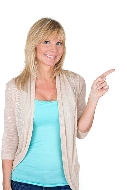 istock mid adult woman pointing 180838354