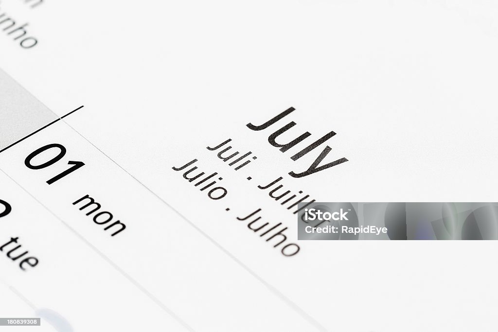 Calendar shows July, labelled in many languages "A non-specific calendar shows the month of July, labelled in English, French, Portuguese, Spanish and German. European summertime!" Blank Stock Photo