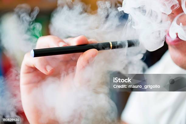 Smoking Ecigarette Stock Photo - Download Image Now - Electronic Cigarette, Cigarette, Electricity
