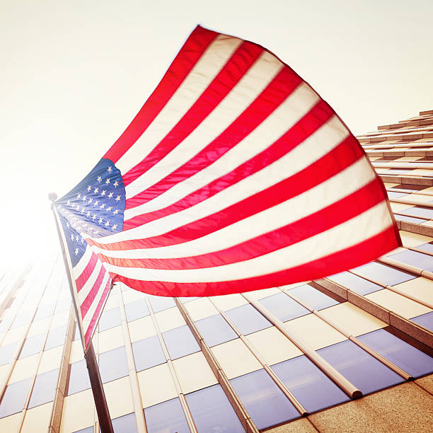 istock United States Flag Waving in Wind 180839489