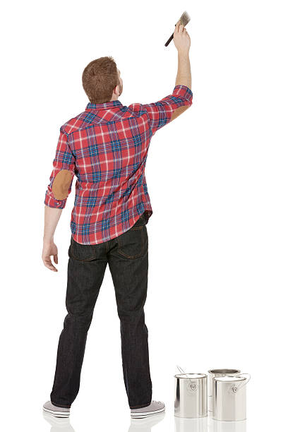 istock Rear view of man painting a wall 180839569