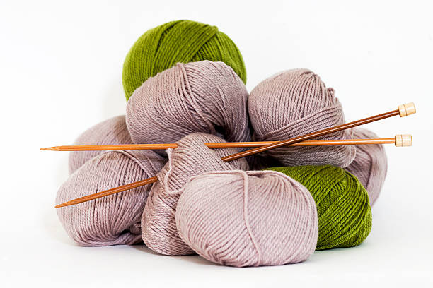 istock Balls of Wool with bamboo knitting needles against white background 180839605