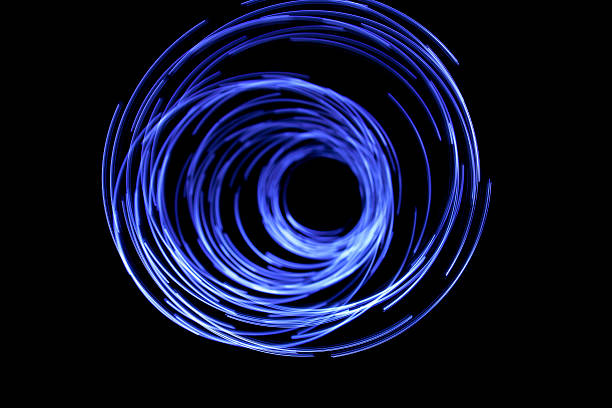 istock glowing circular blue, long exposure of creative light painting 180839980
