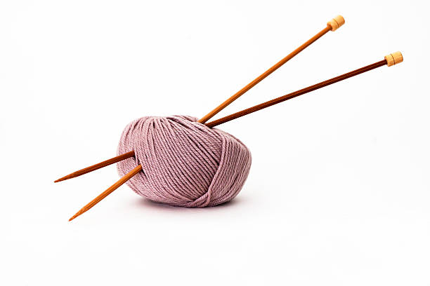 istock Ball of  Wool with knitting needles, white background, copy space 180840506