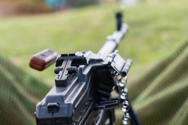 istock Soviet-made PK machine gun and camouflage netting.. 