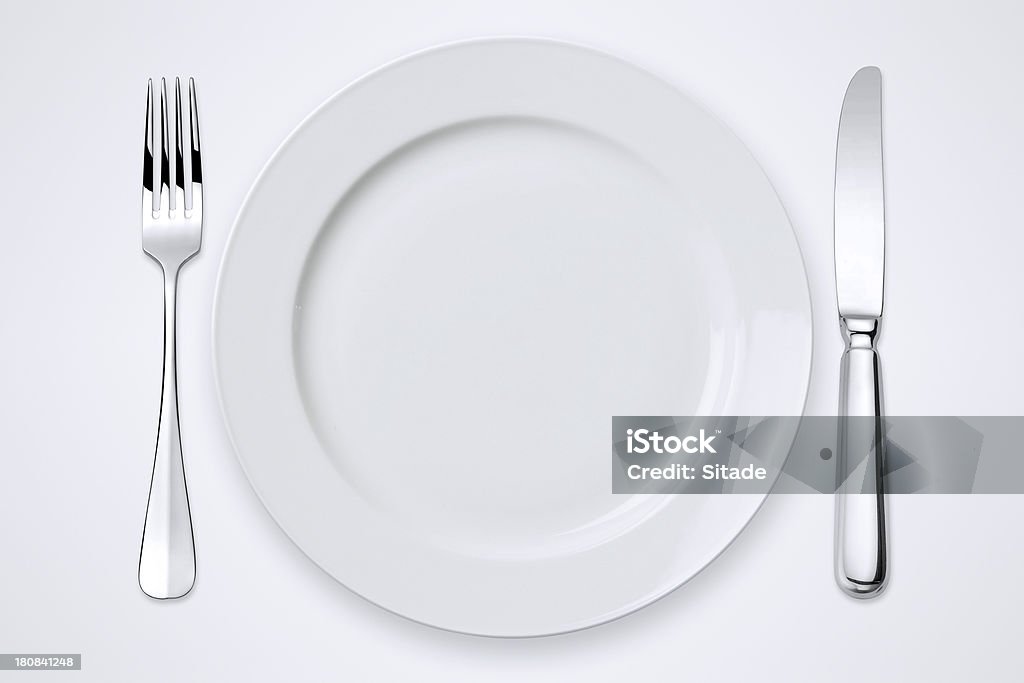 Table Setting With Clipping Paths "Table setting with clipping path for the plate, forks and knife." Plate Stock Photo