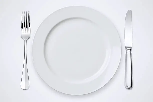 "Table setting with clipping path for the plate, forks and knife."