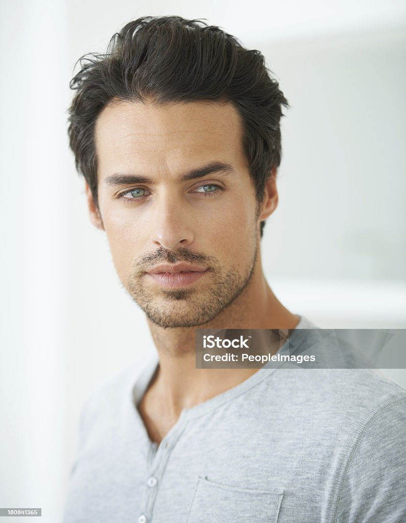 He's a handsome man Head and shoulder shot of a handsome young man looking away Men Stock Photo