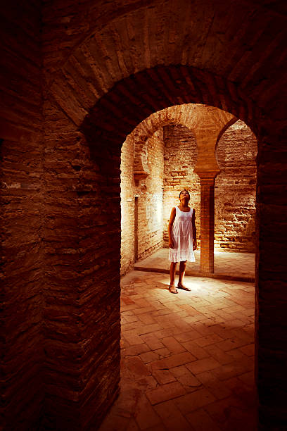 Little girl  walking in the palace of the Alhambra, Granada, Spain