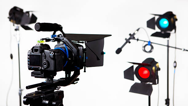 istock DSLR video camera with lights and microphone 180841660