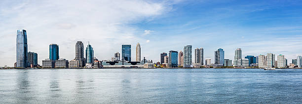 Skyline of Downtown Jersey City, panorama Panorama of skyline of Downtown Jersey City, Hudson County, New Jersey, United States. jersey city stock pictures, royalty-free photos & images