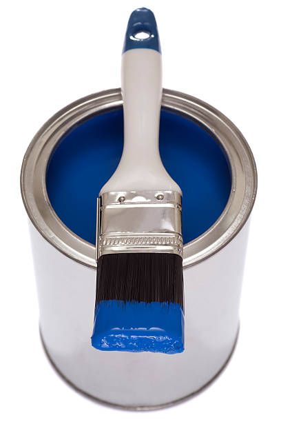 istock Paintbrush on a tin of blue paint 180841825