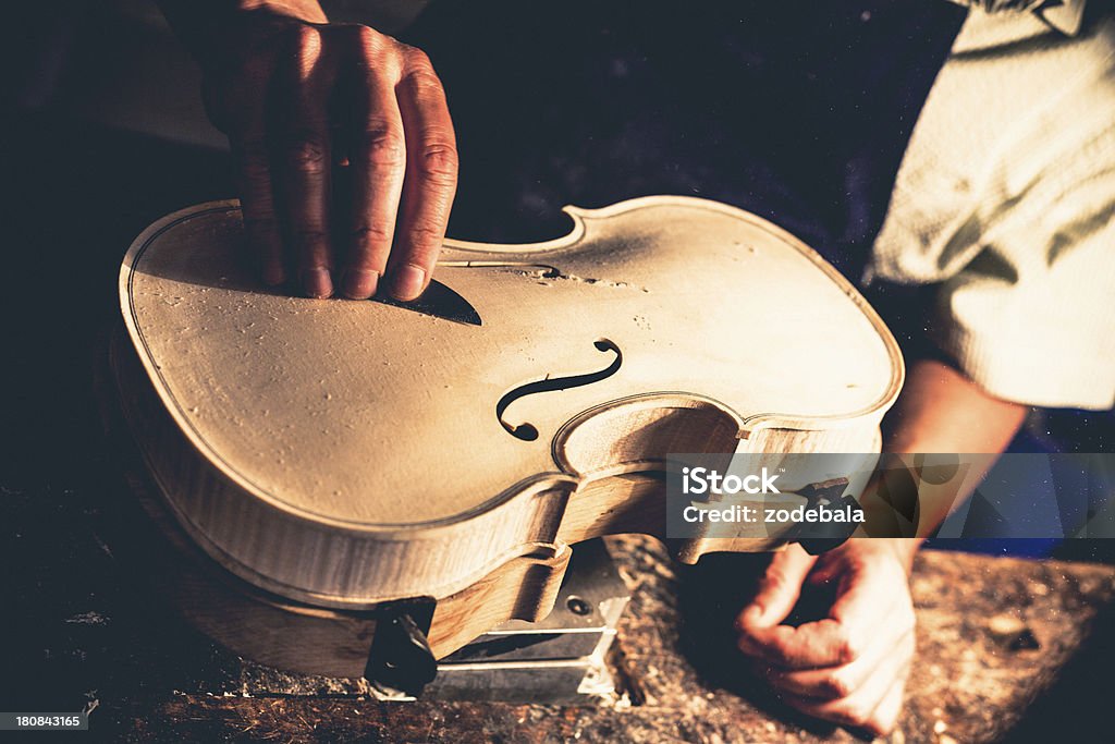 Violin Maker in Cremona, Italy Violin maker in Cremona. From the 16th century onwards, Cremona was renowned as a centre of musical instrument manufacture. Cremona Stock Photo