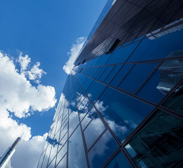 istock Clouds reflected in modern office buildings, Frankfurt, Germany 180843359