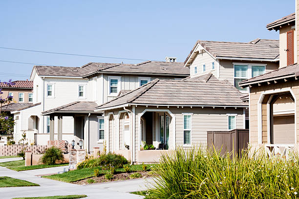 istock Neighborhood Home Exterior and Blue Sky 180843939
