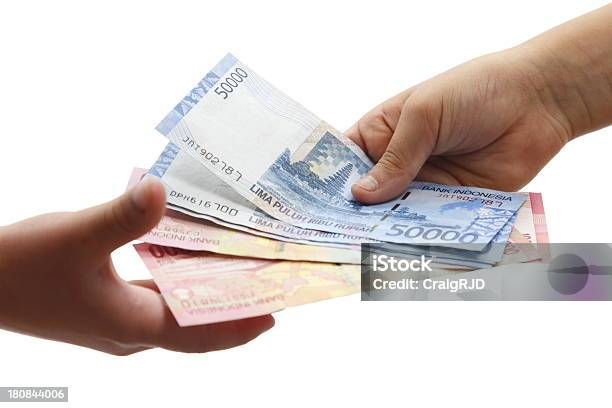 Indonesian Payment Stock Photo - Download Image Now - Indonesian Currency, Currency, Bribing