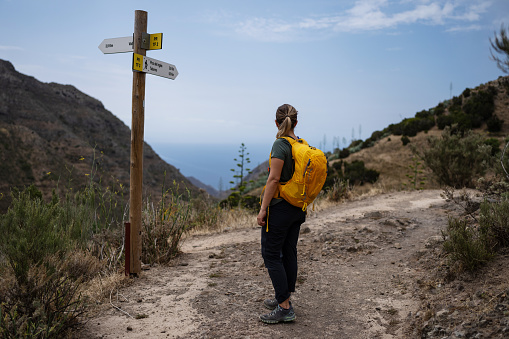 Woman hiking in majestic landscapes of Tenerife