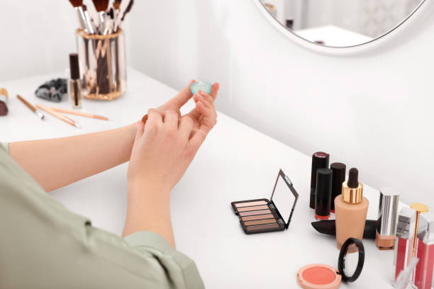 istock Woman applying perfume on wrist at dressing table indoors, closeup 1808446611