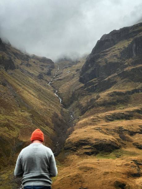 Rear view of an unrecognizable man flying drown at Glencoe