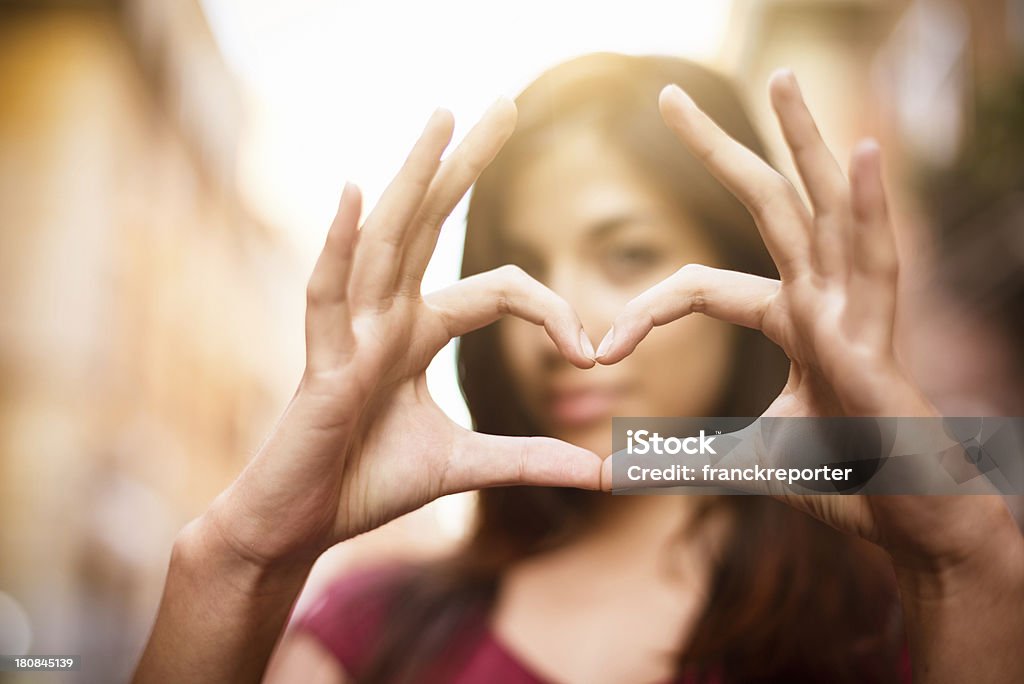 Close-up of woman making a heart shape with hands http://blogtoscano.altervista.org/su.jpg  Heart Shape Stock Photo