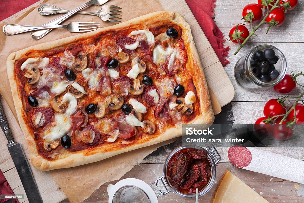 Homemade Pizza Rectangular Homemade Rectangular Pizza On A Rustic Table With Ingredients Stock ...