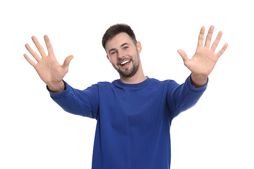 Man giving high five with both hands on white background